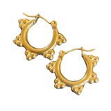 Golden hoop ear rings with 5 sets of three bubbles forming tiny triangle flairs.