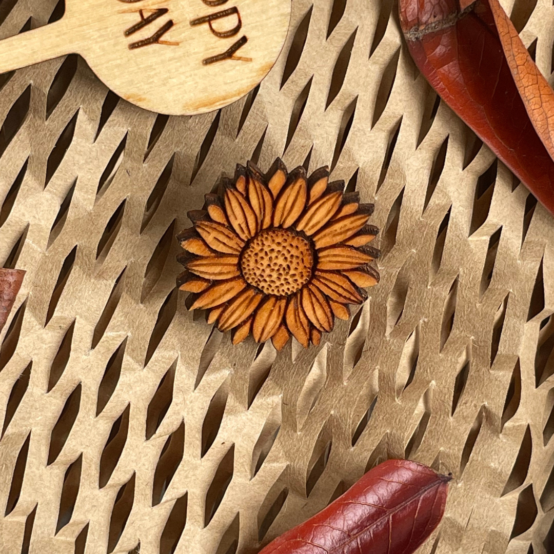 Wooden Sunflower Pin on a natural background