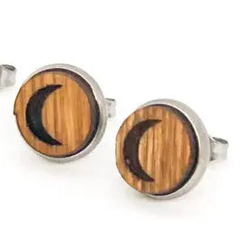 Wooden stud earrings with a crescent moon design on a white background