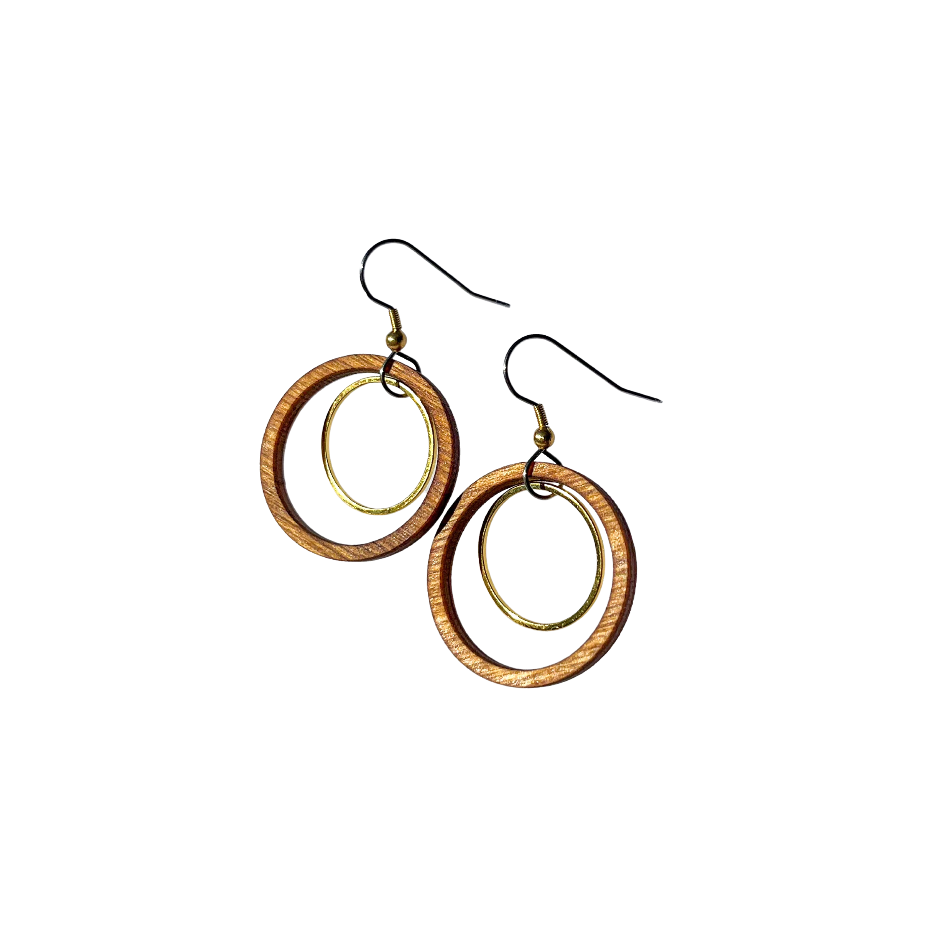 A pair of large circular earrings with a wooden circle surrounding a metal ring.