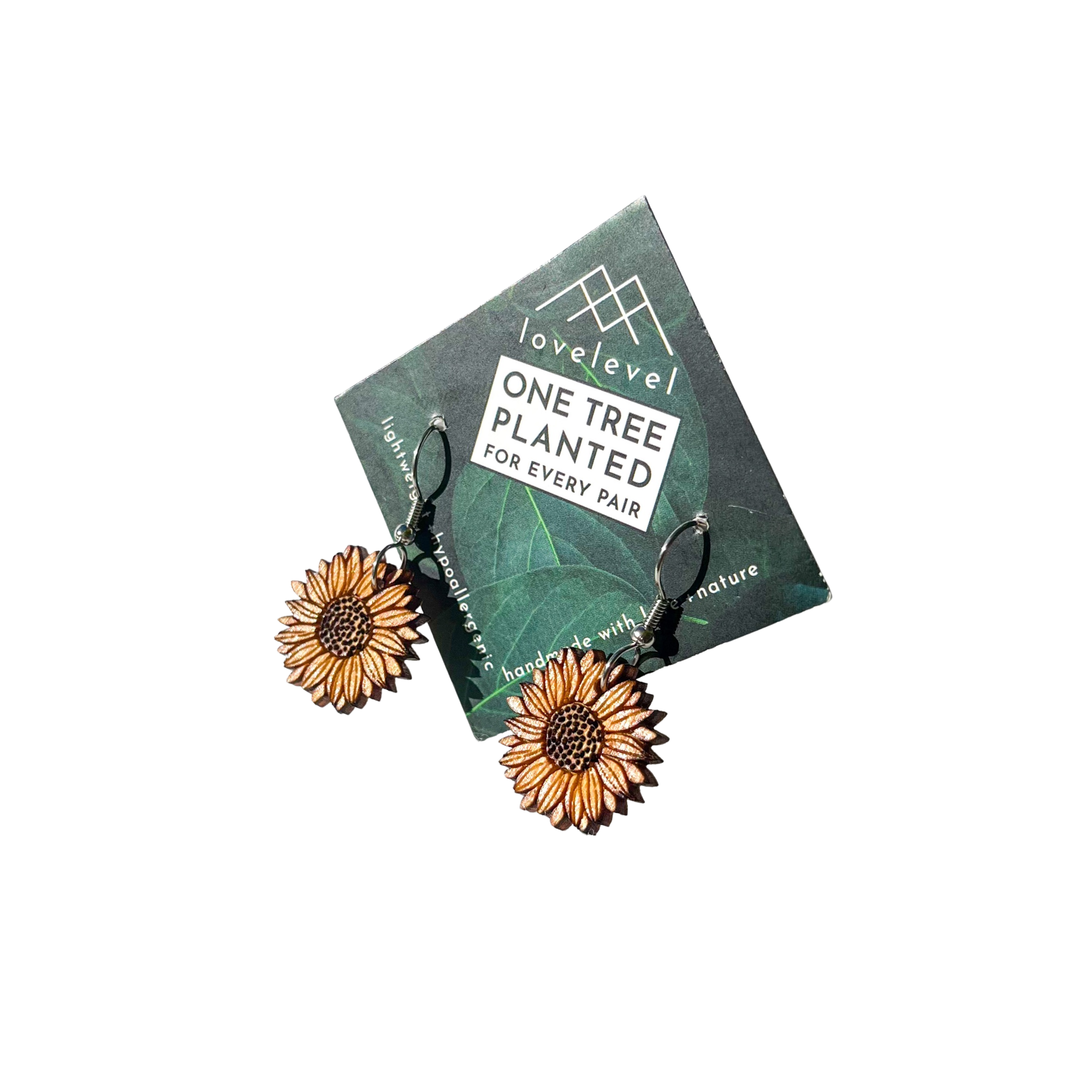 Wooden sunflower dangle earrings on a card with 'lovelevel' branding.