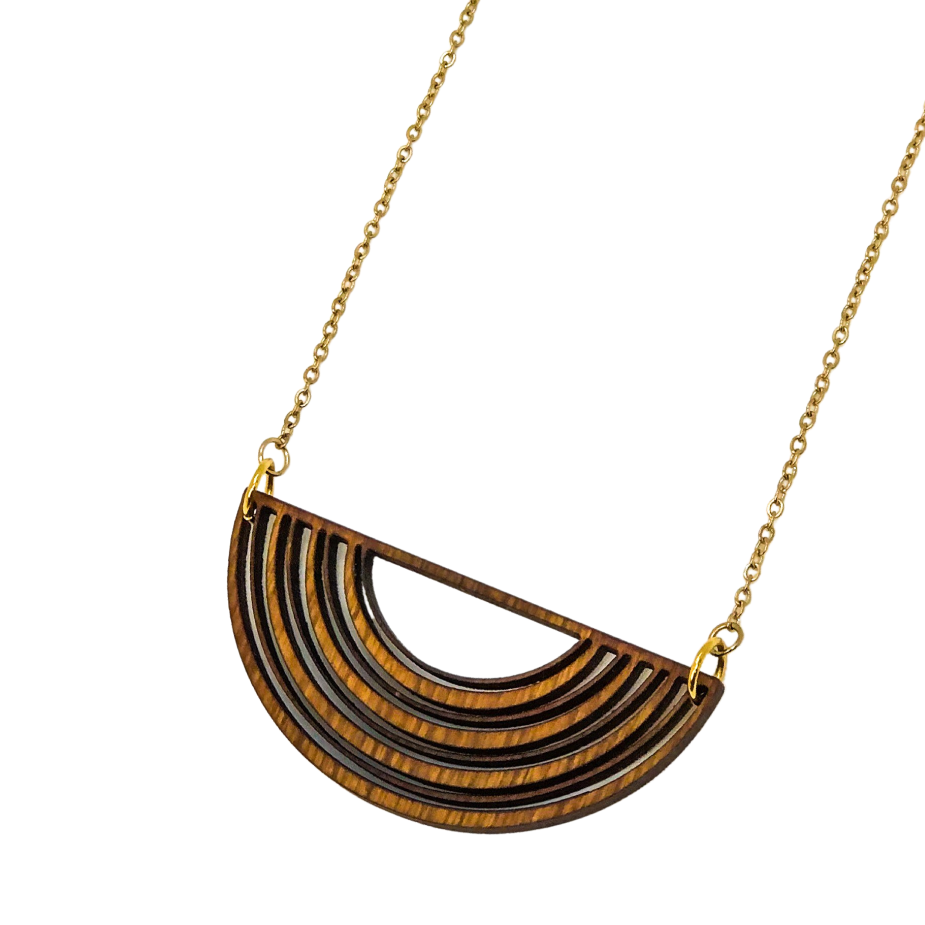 Gold necklace with a half-circle wooden pendant on a white background