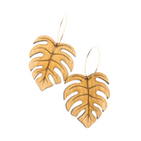 Wooden earrings carved in the shape of Monstera leaves.