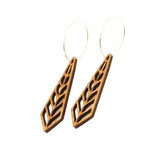 Diamond shaped wooden earrings on a white background.