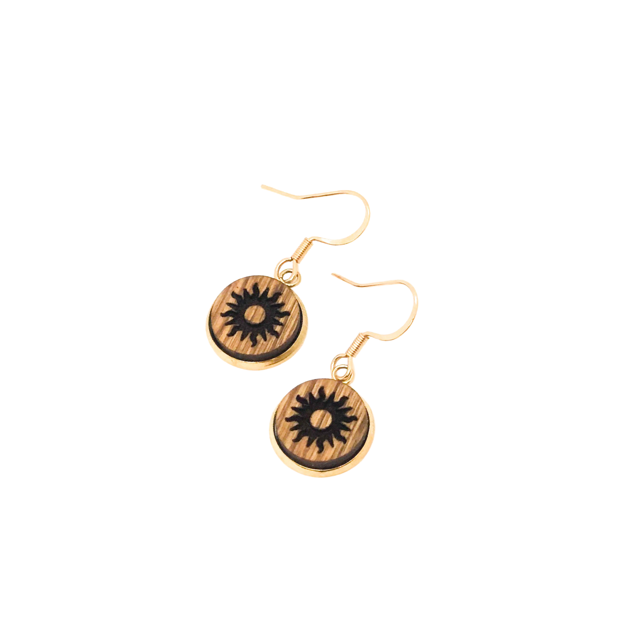 Small wooden dangle earrings with a sun engraving.