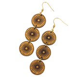 Wooden circular dangle earrings on a white background