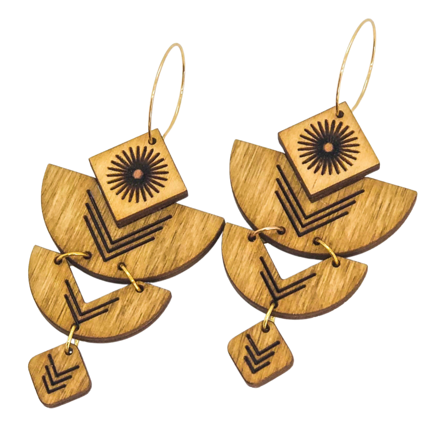 Wooden earrings with geometric designs on a white background