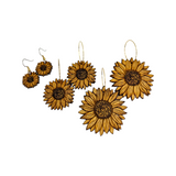 Wooden sunflower earrings, a small pair, a medium pair, and a large pair.