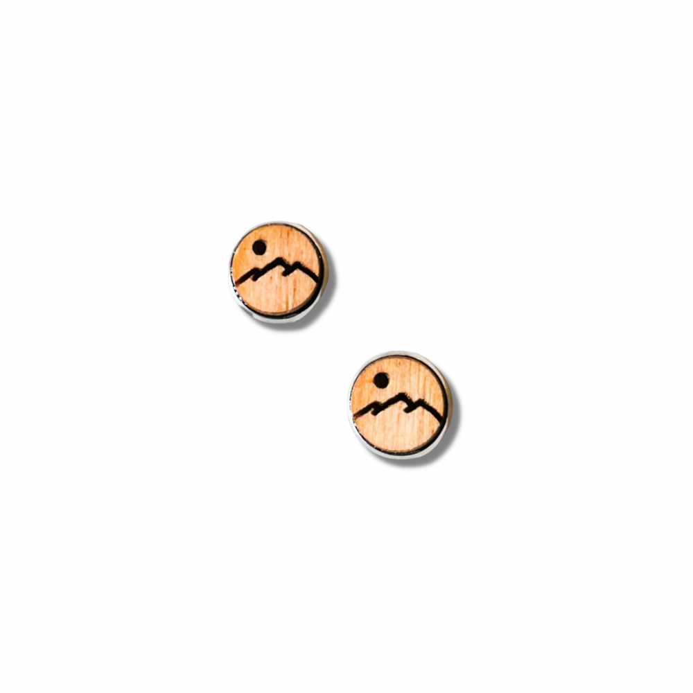 Wooden stud earrings with a mountain peak etched into them.