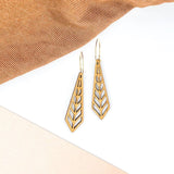 Wooden slim geometric earrings in a diamond shape.