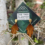 Wooden drop earrings with wooden art-deco arches dropping from a gold stud.