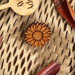 Wooden Sunflower Pin on a natural background