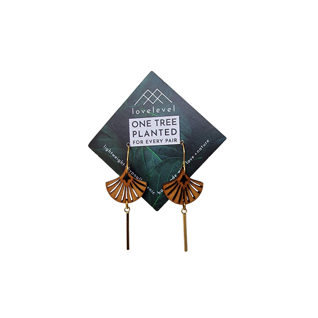 Wooden art deco shell earrings with a small metal bar dangling down from the shell.