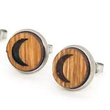 Wooden stud earrings with a crescent moon design on a white background