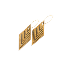 A pair of wooden incline design earrings with a geometric pattern, displayed against a white background.