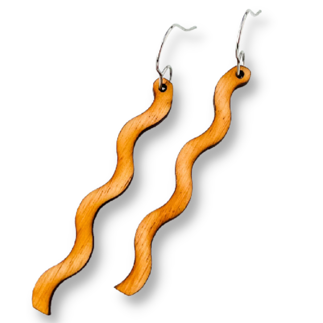 Wooden wavy earrings on a white background